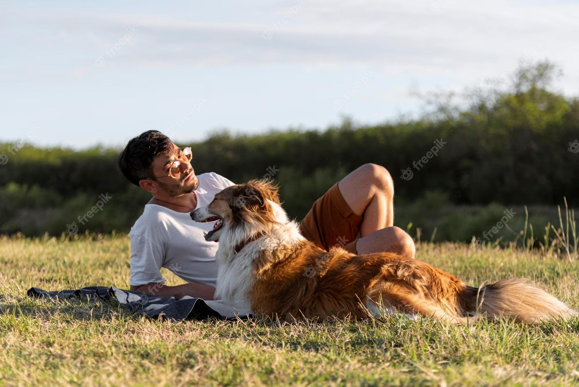 young-man-with-dog-seaside_23-2148885055.jpg